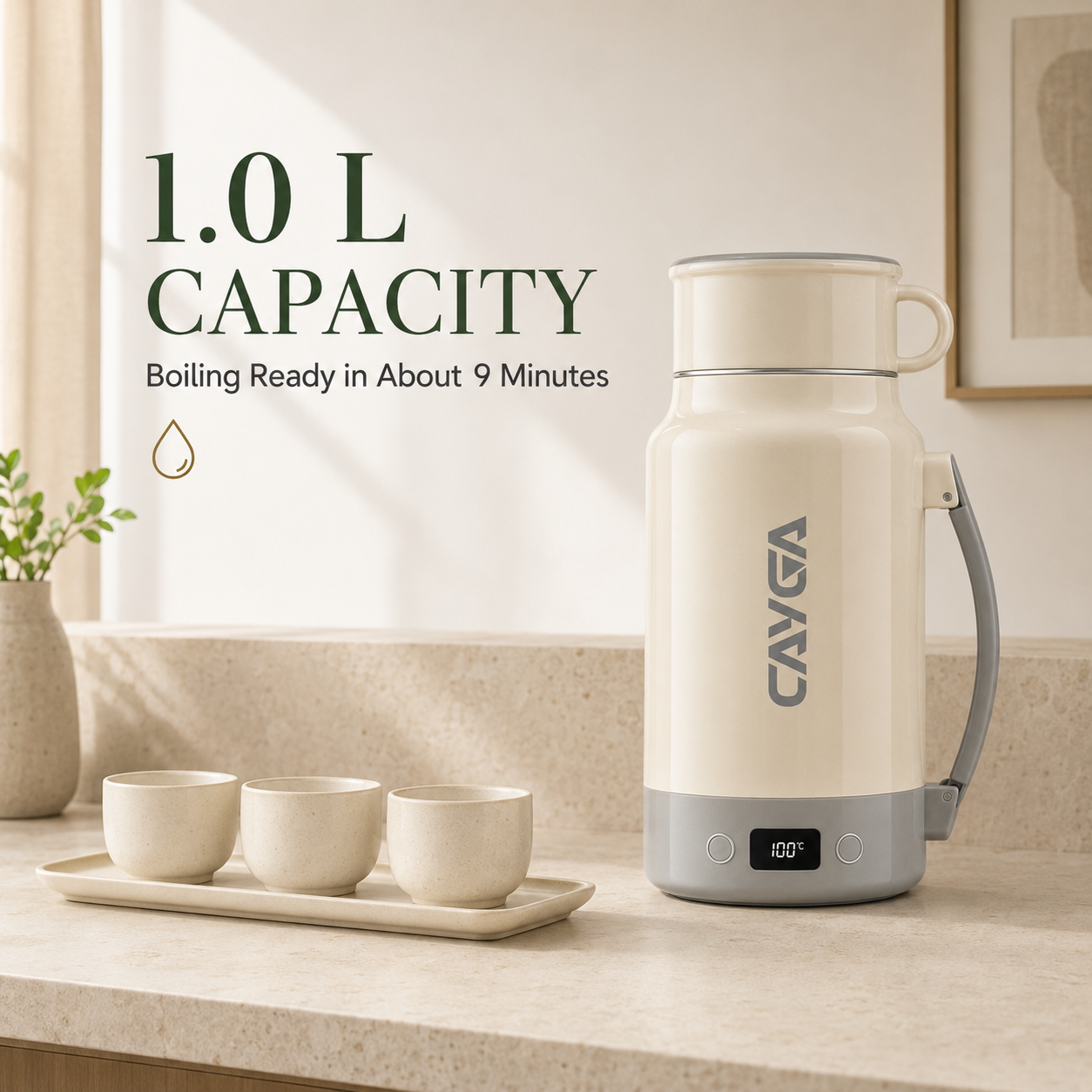 A 1.0 L insulated water boiler with a cream-colored body and gray accents, shown on a kitchen counter next to three small cups.