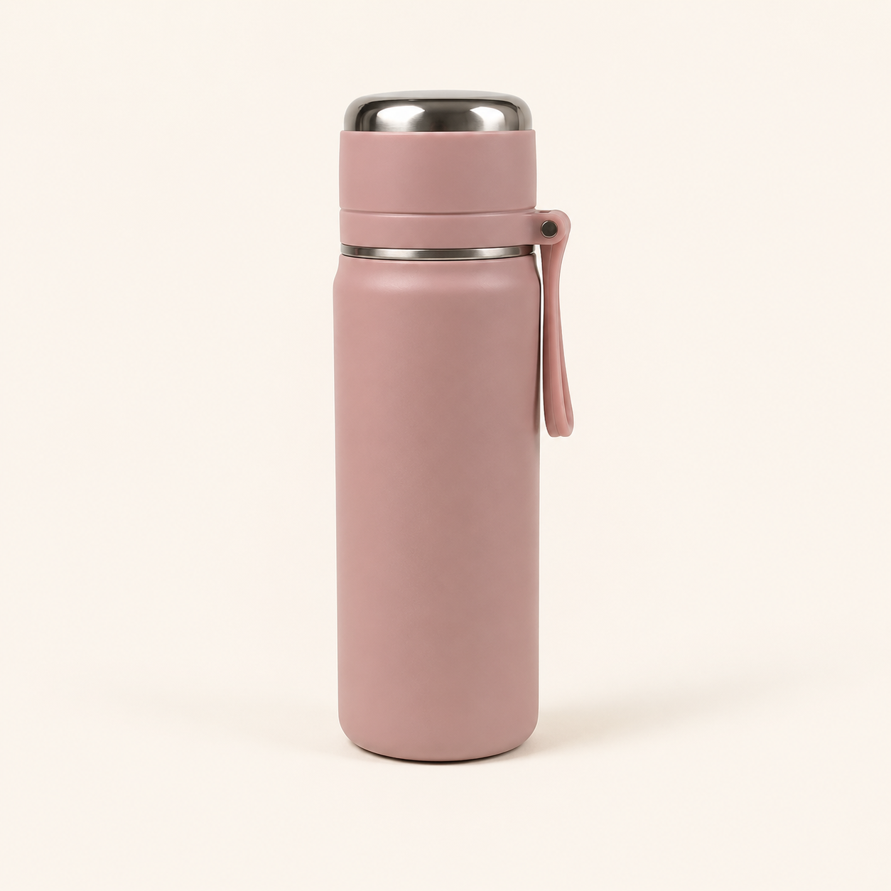 A matte dusty pink insulated water bottle with a stainless steel lid and a matching pink carrying loop, shown on a clean off-white background.