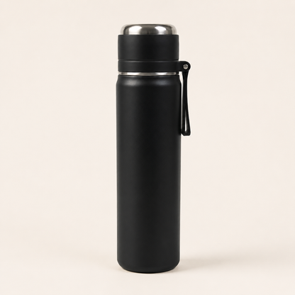 A matte black insulated water bottle with a stainless steel lid and a black carrying loop, shown on a plain light beige background.