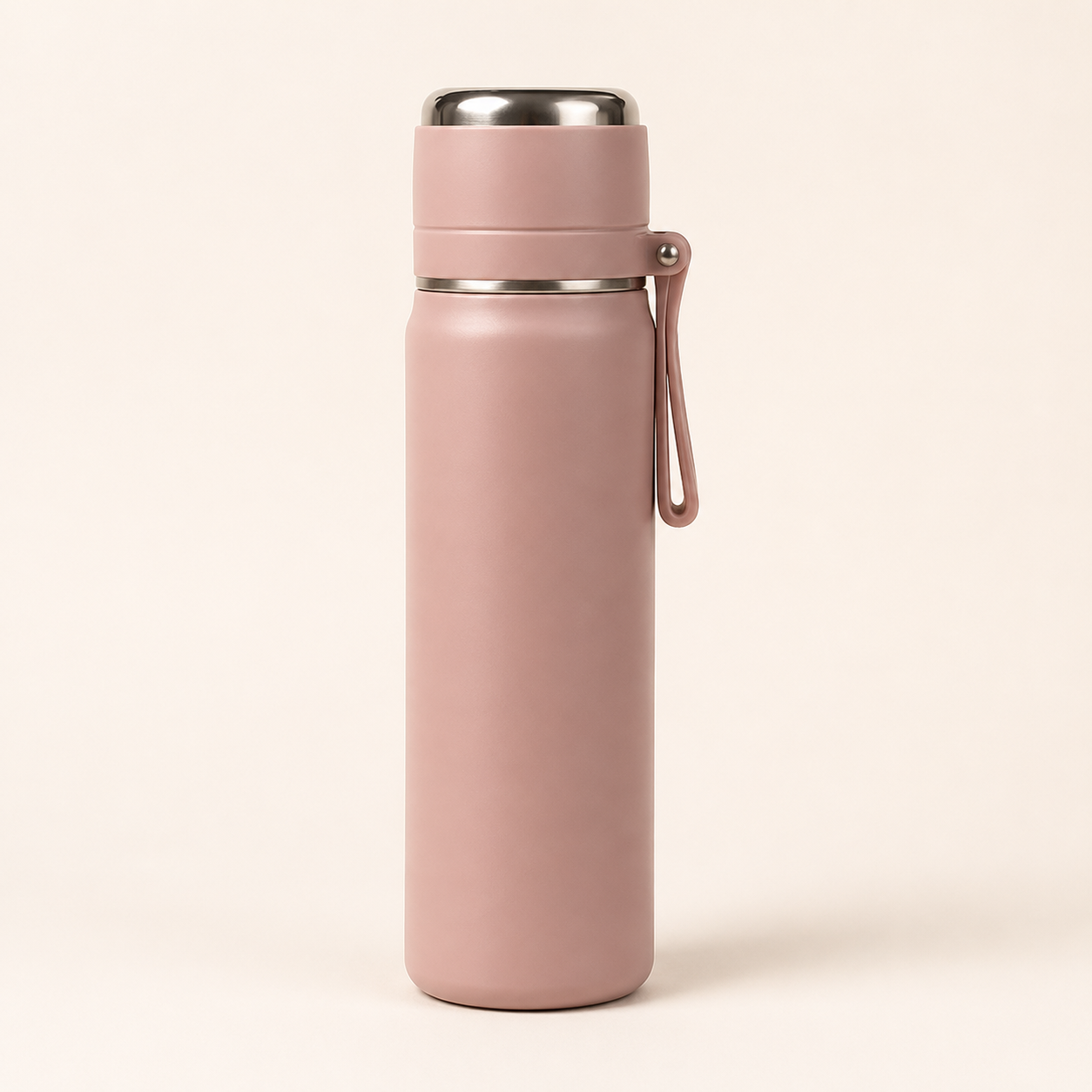 A matte dusty pink insulated water bottle with a stainless steel lid and a matching pink carrying loop, standing upright on a light beige background.