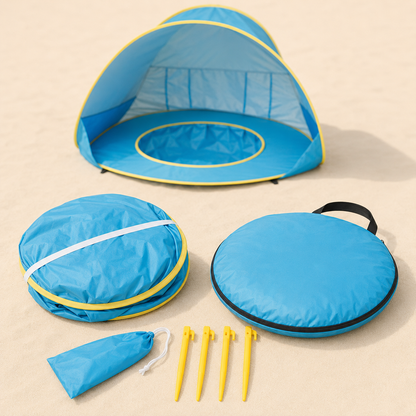Blue beach pop-up tent with yellow trim, shown open with its round carrying case, folded case, four yellow tent stakes, and a small blue drawstring pouch on a sandy beige background.