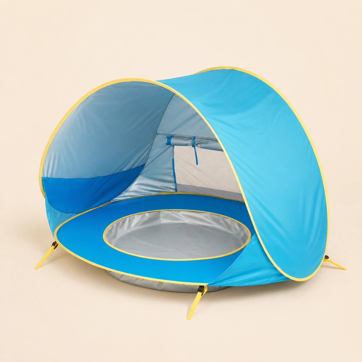 A blue pop-up beach tent with yellow trim and a silver reflective floor, shown on a plain beige background.
