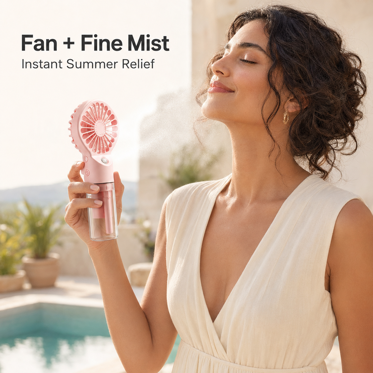 A woman in a cream dress holds a pink handheld fan with fine mist spray next to a pool, with text reading 'Fan + Fine Mist Instant Summer Relief'.