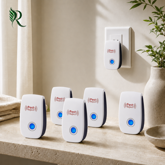 Five Pest Reject electronic bug zappers are displayed on a light stone countertop, with one shown plugged into a wall outlet in the background. The devices are white with dark gray side panels and a glowing blue button, featuring the red 'Pest Reject' logo.
